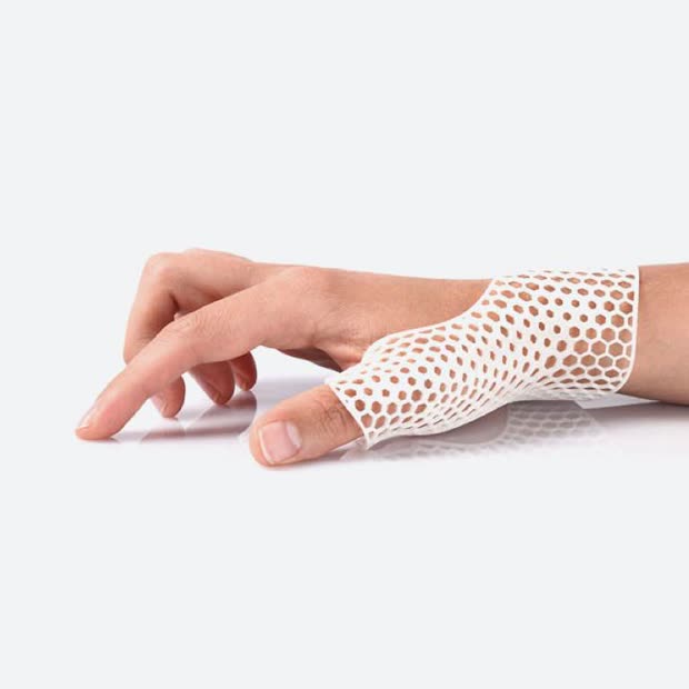 A lattice wrist support worn on a hand